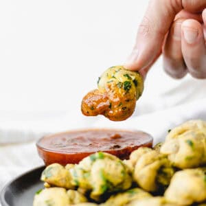 red sauce covering garlic knot