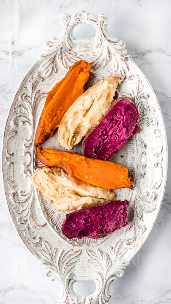 six sweet potato halves on a white dish cooked in the instant pot