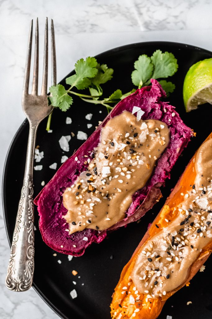 purple instant pot sweet potato with tahini butter on balack plate