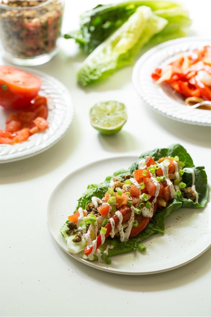 white plate with romaine lettuce leaf with pico