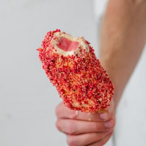 frozen strawberry shortcake bar held in a hand