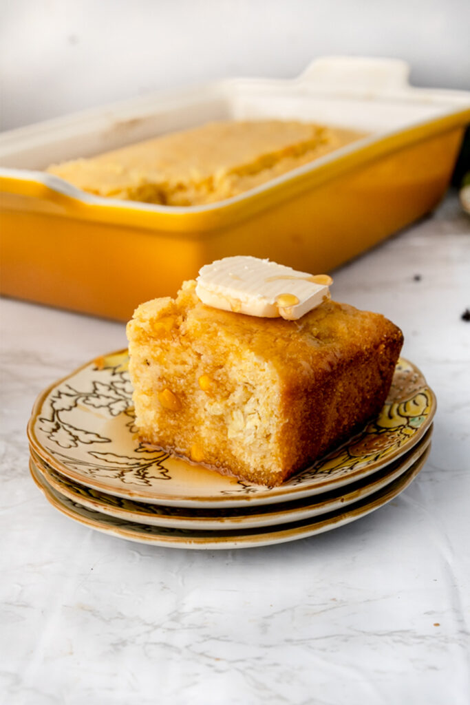 pat of butter on top of a vegan cornbread slice