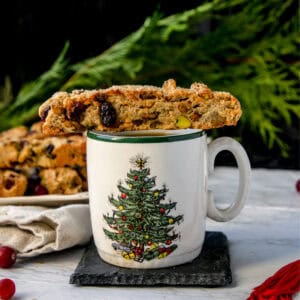 vegan biscotti sitting on top of a white cup of coffee