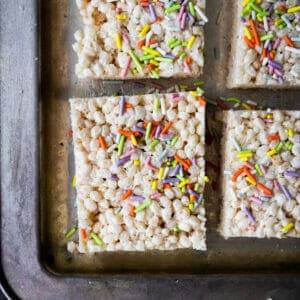 close up of vegna brown butter rice krispie with rainbow spirinkles