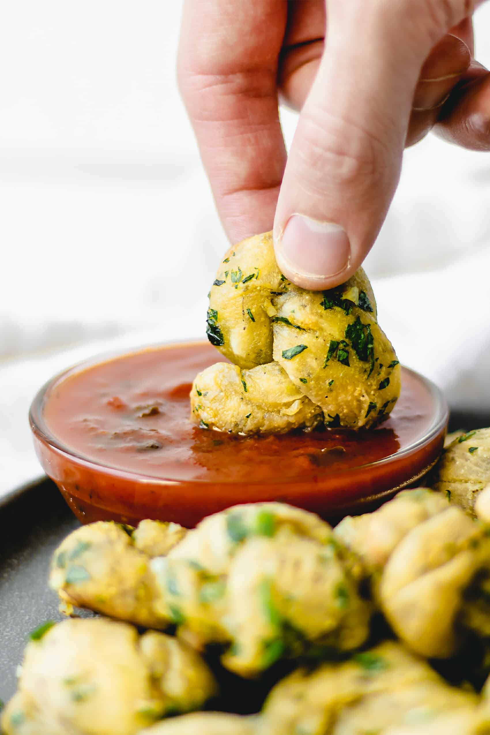 red sauce covering garlic knot