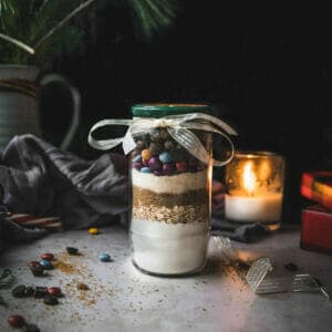 jar of vegan cookie mix on a marble table ties with a bow