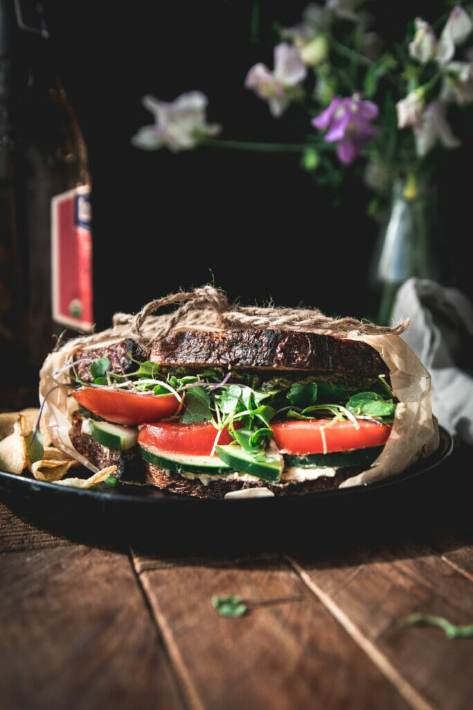 side view of a vegan california veggie sandwich on crusty bread