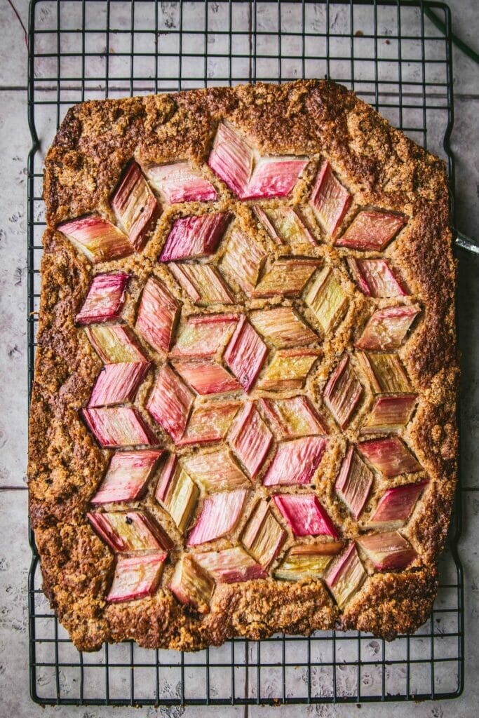 overhead shot of a tessellated rhubarb cake once baked
