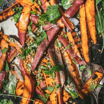 overhead shot of a tray of grilled sweet potato salad with minty lime yogurt dressing