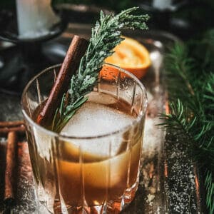 angled shot of a cinnamon maple whiskey sour cocktail