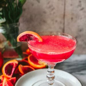 a side view of a blood orange screwdriver cocktail