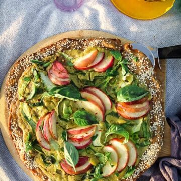 overhead view of a peach zucchini pizza