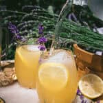 water pouring into a glass of lavender ginger lemonade