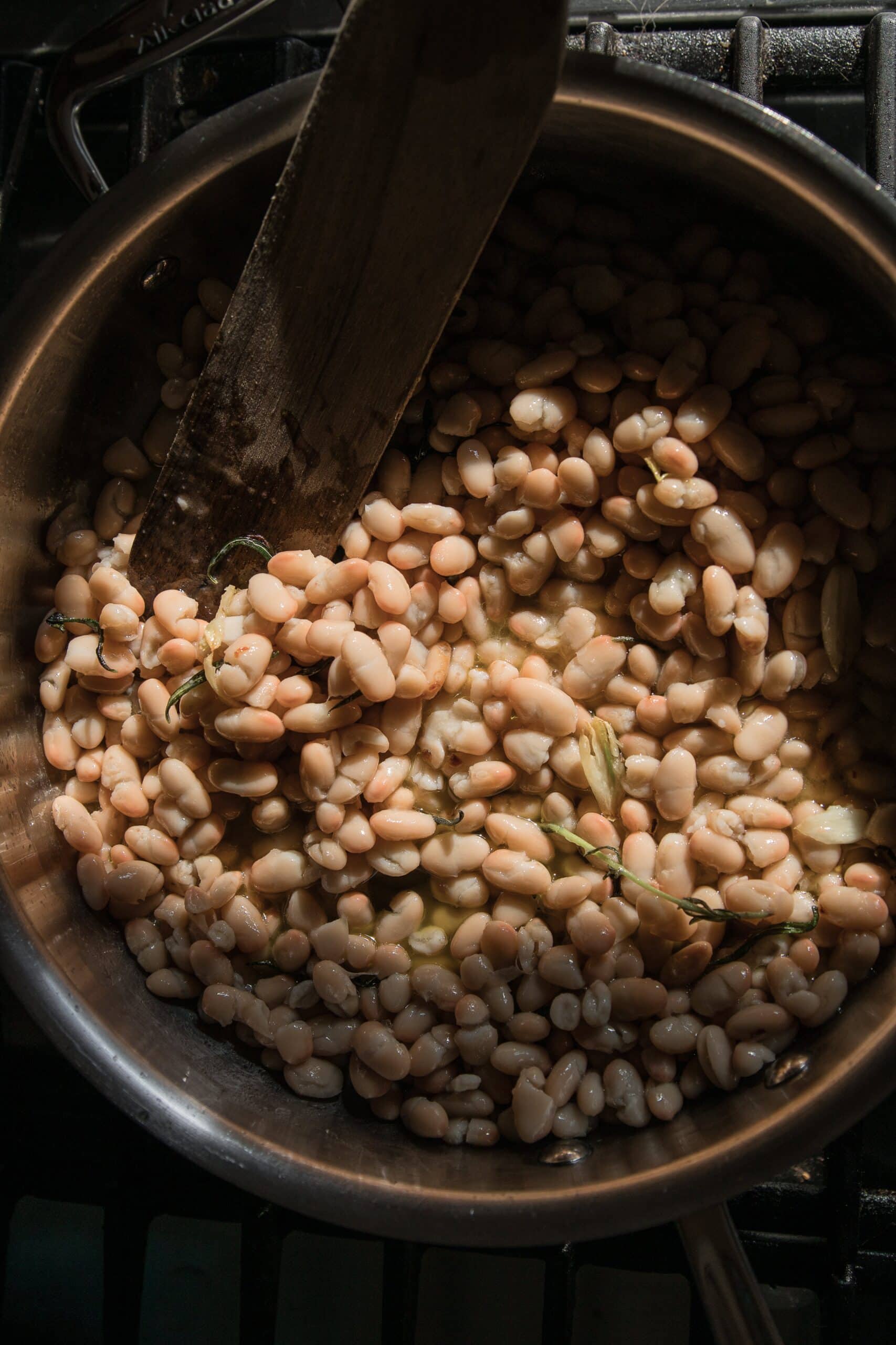 braised white beans on the stove