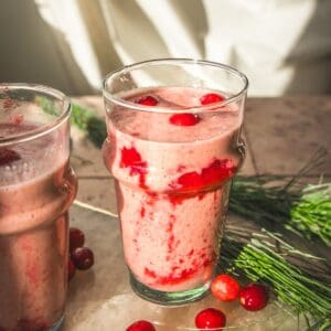 two vegan cranberry orange smoothies