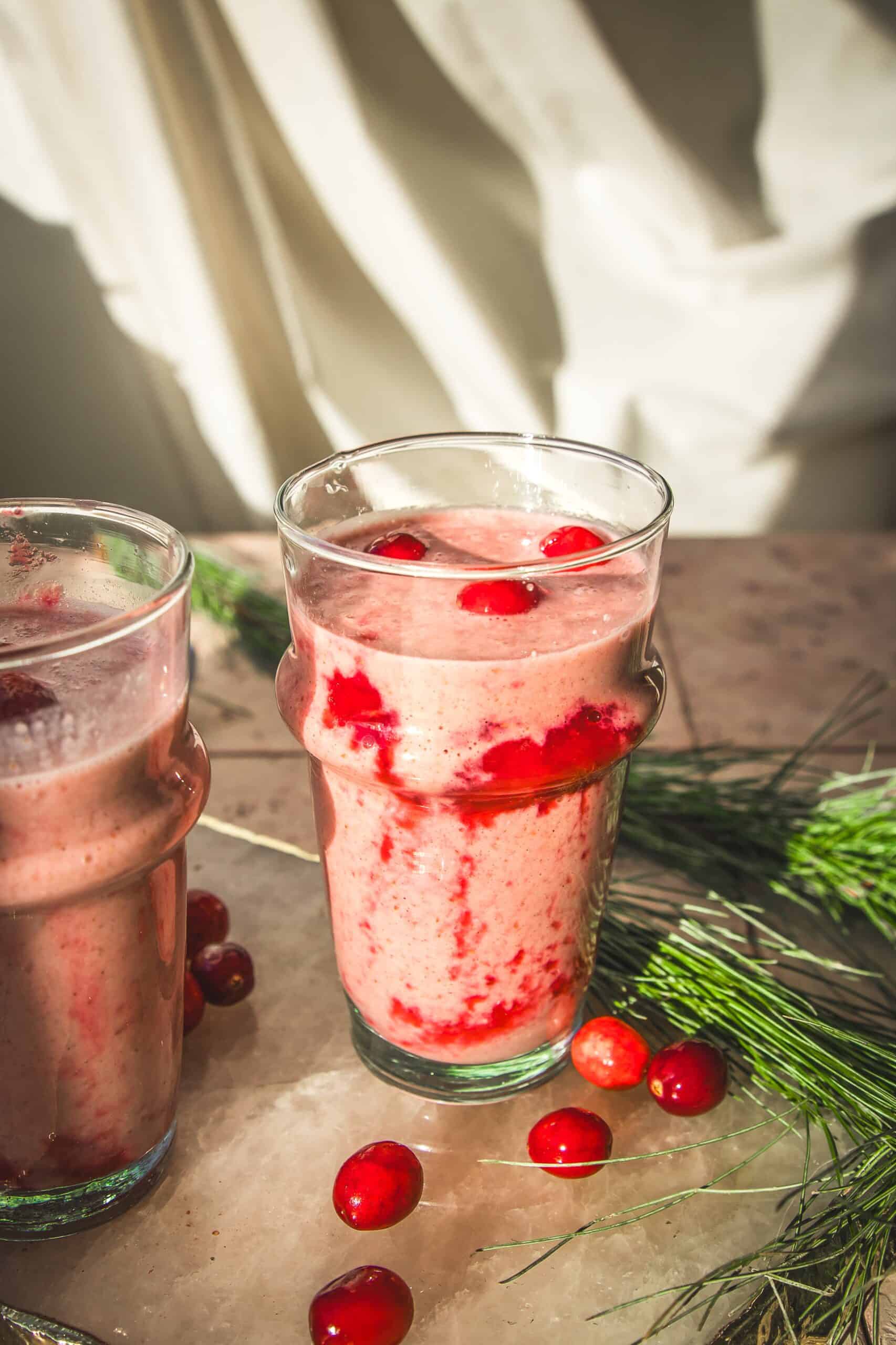 two vegan cranberry orange smoothies.